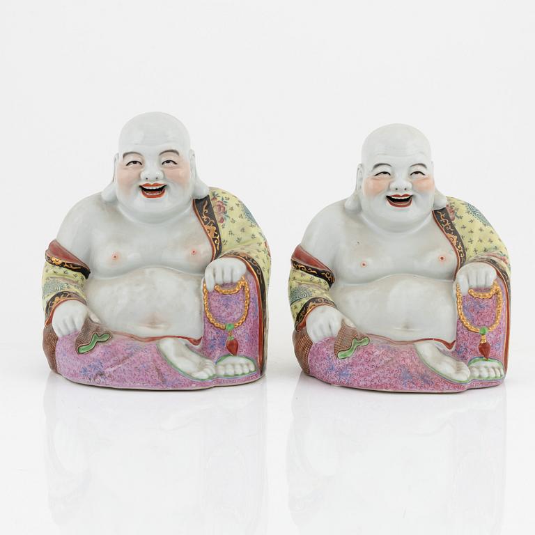 A pair of porcelain laughing Buddhas, China, 20th century.