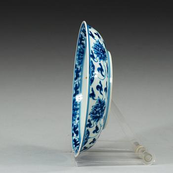 A set of four blue and white lotus dishes, Qing dynasty, with Kangxi six character mark.