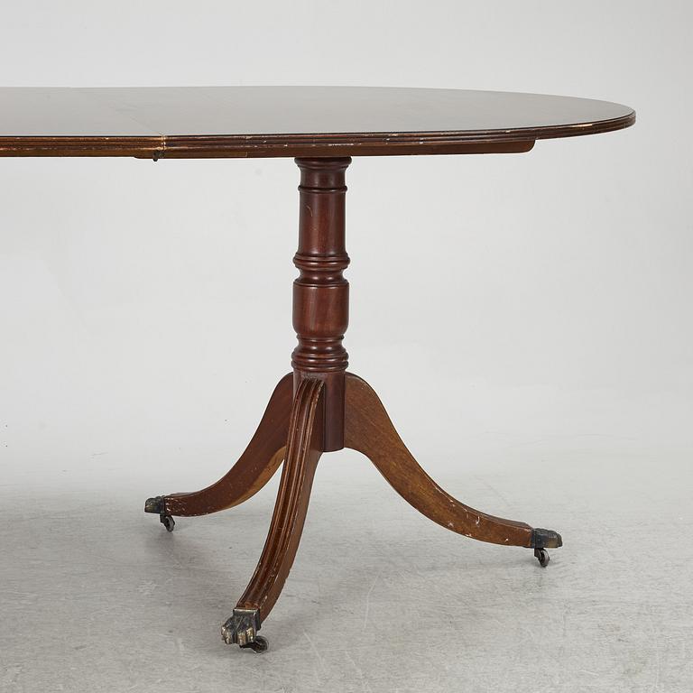 A dining table, 20th century, England.