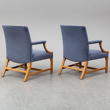 A mid 20th Century pair of oak armchairs attributed to Carl Malmsten.
