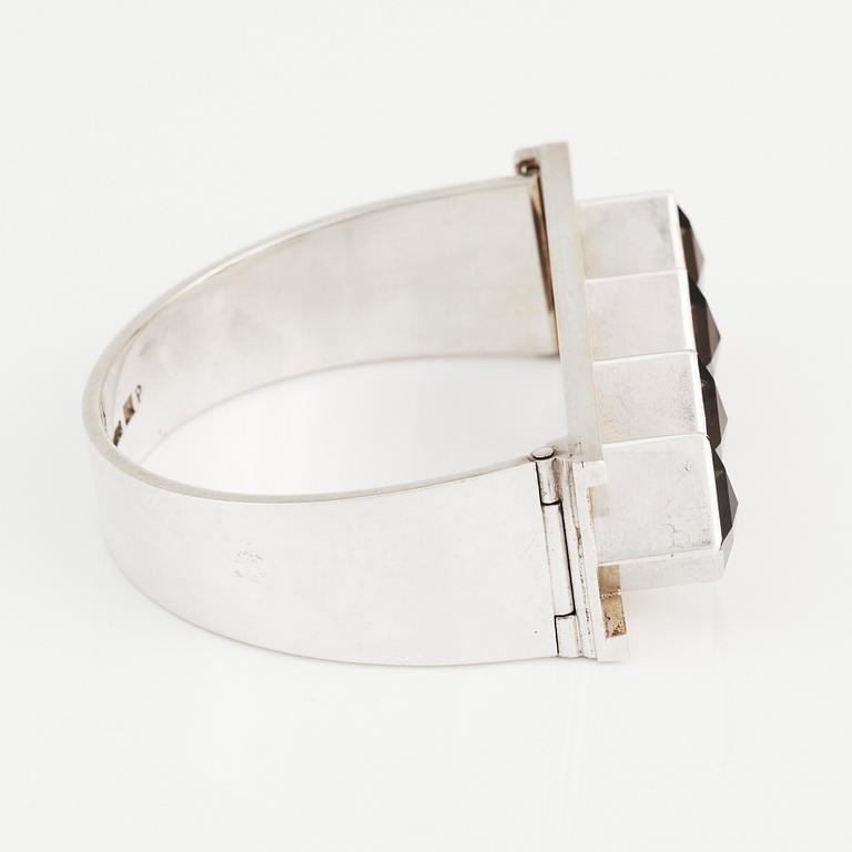 Sigurd Persson, a sterling silver, part gilt bangle with smoky qvartz (citrine), Stockholm 1963, executed by silversmith Peter Schmitt.