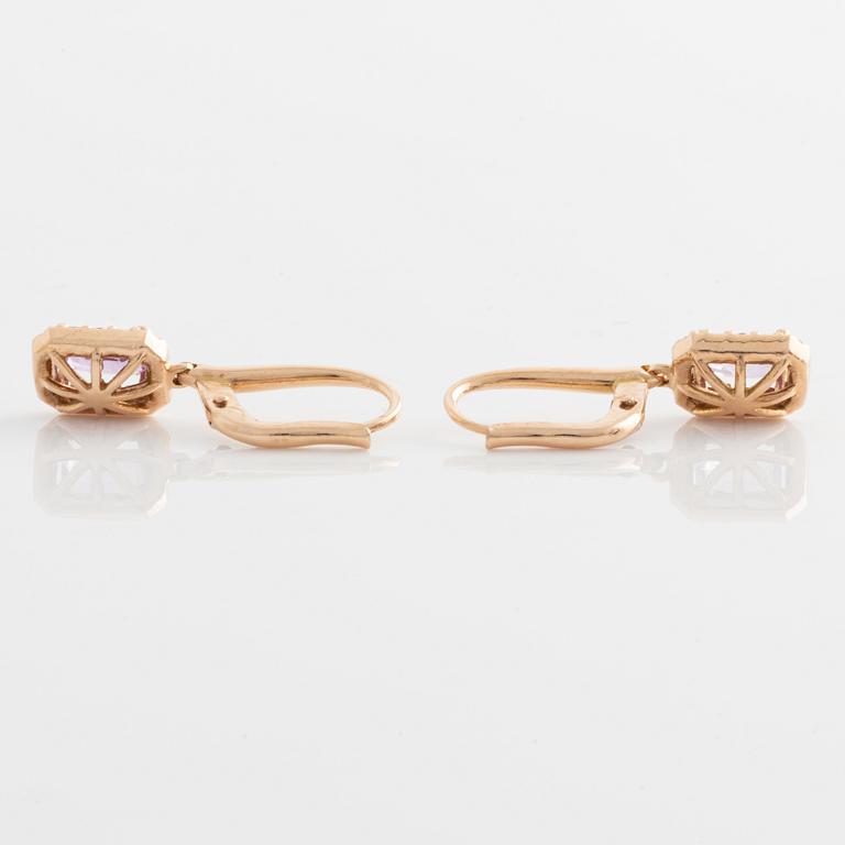 Earrings with pink sapphires and diamonds.