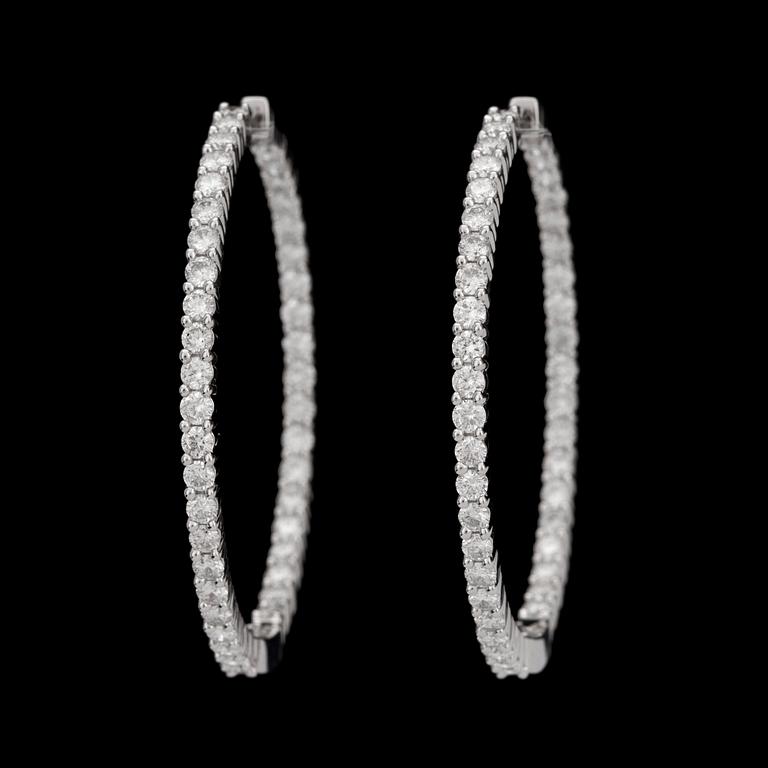A pair of diamond, 2.64 cts in total, earrings.
