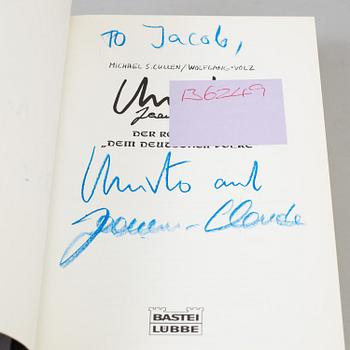 CHRISTO & JEANNE-CLAUDE, a set of three books about "Wrapped Reichtag", signed.