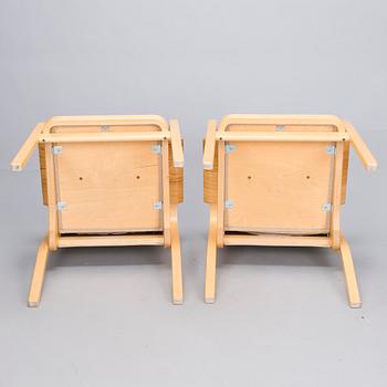 ALVAR AALTO, Pair of model 'E45' armchairs for Artek, late 20th Century.