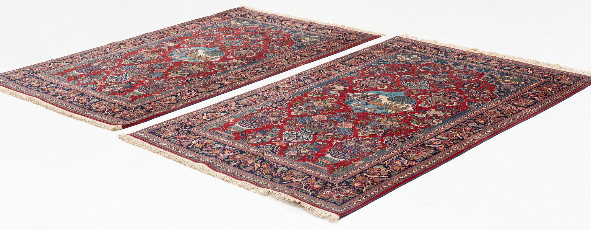A pair of semi-antique pictoral Kashan rugs, ca 200 x 130 and 197 x 128 cm.