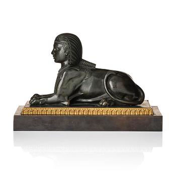 261. A French Empire bronze sfinx.