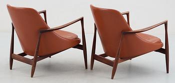 A pair of Ib Kofod Larsen 'Elisabeth' palisander and brown leather easy chairs.