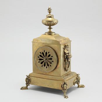 A table clock and two candelabras, around the year 1900.