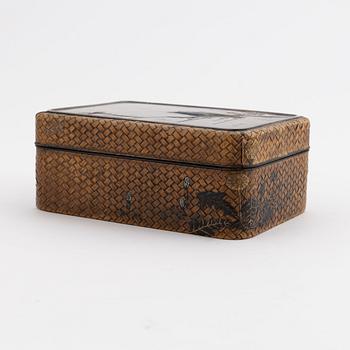 A Japanese woven bamboo box with metal inlaid shibuichi top early 20th century.