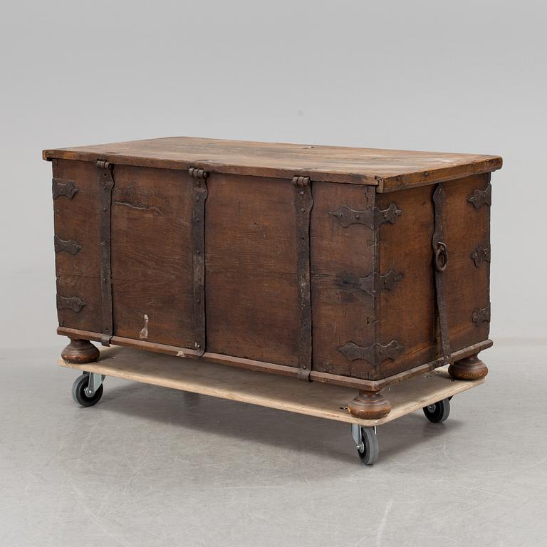 A large 17/17th century baroque oak chest with wrought iron fittings.