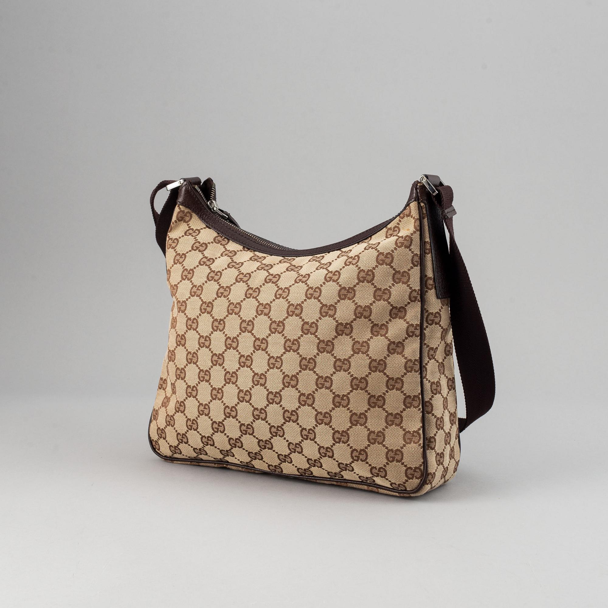 Gucci, a monogram canvas messenger bag.