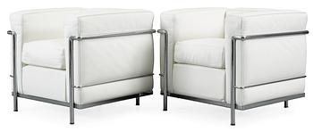 134. A pair of Le Corbusier, 'LC2' chromed steel and white leather easy chair, Cassina, Italy.