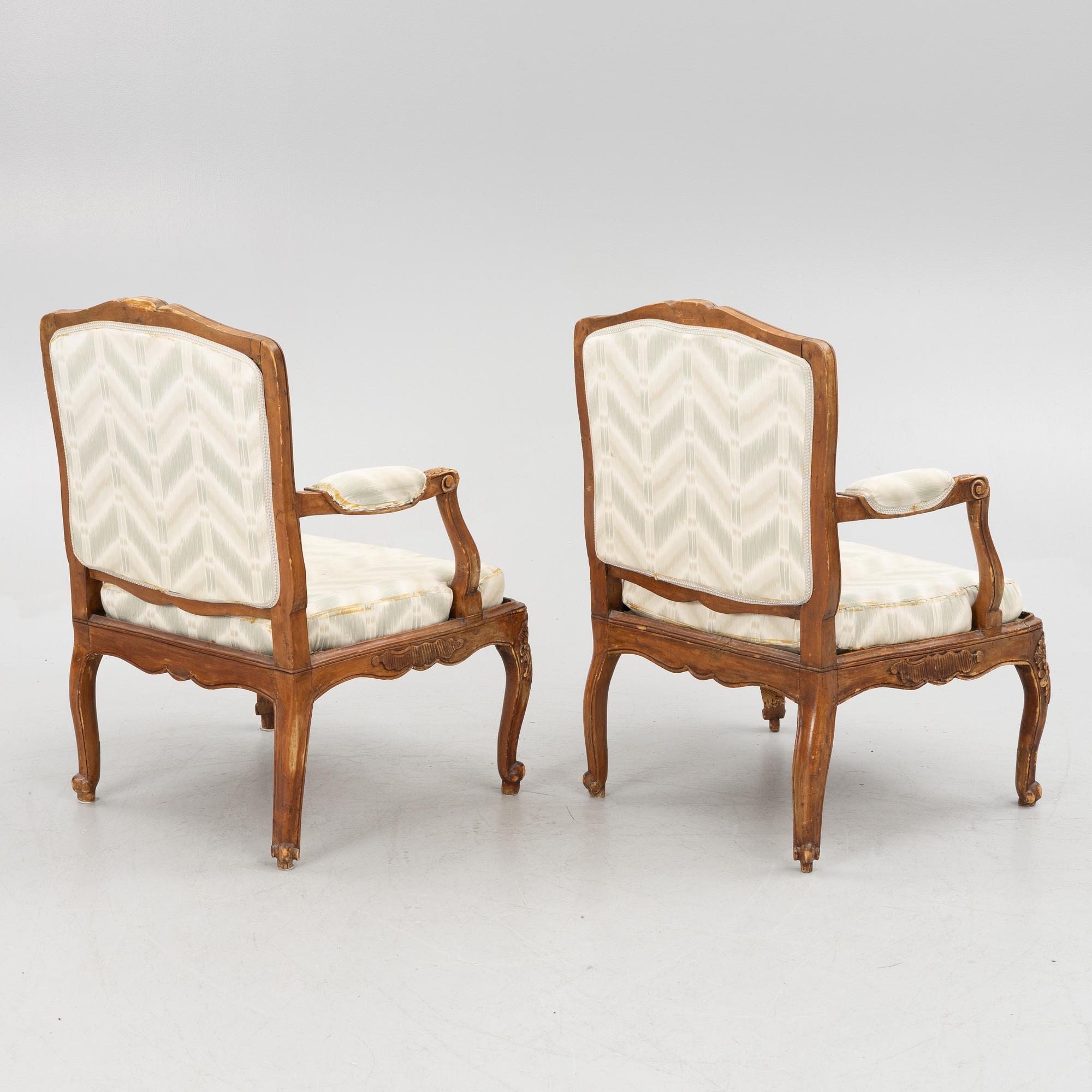 A pair of French Louis XV fauteuils, mid 18th century.