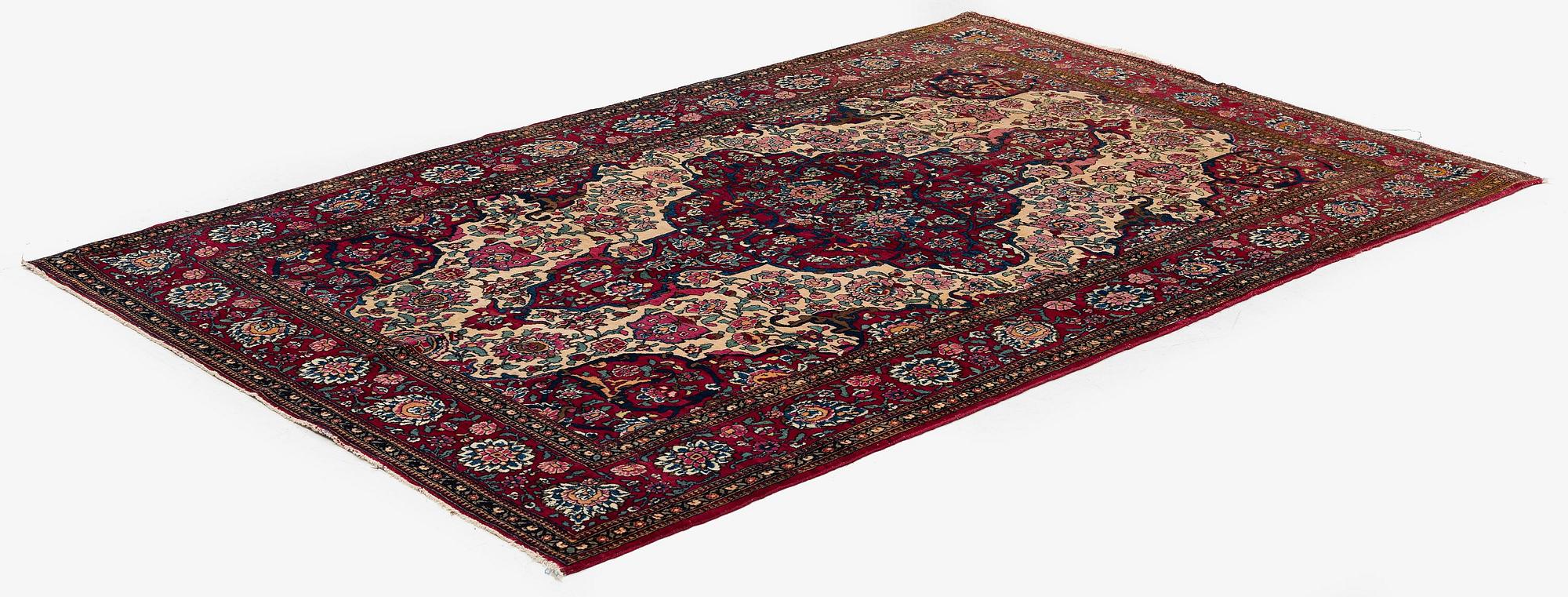 An antique Isfahan rug, Central Persia, c 234 x 146 cm.