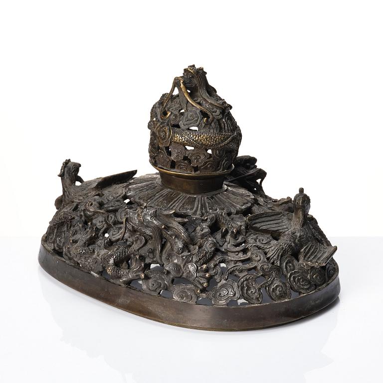 A bronze reticulated incense burner with cover, Qing dynasty (1644-1912).