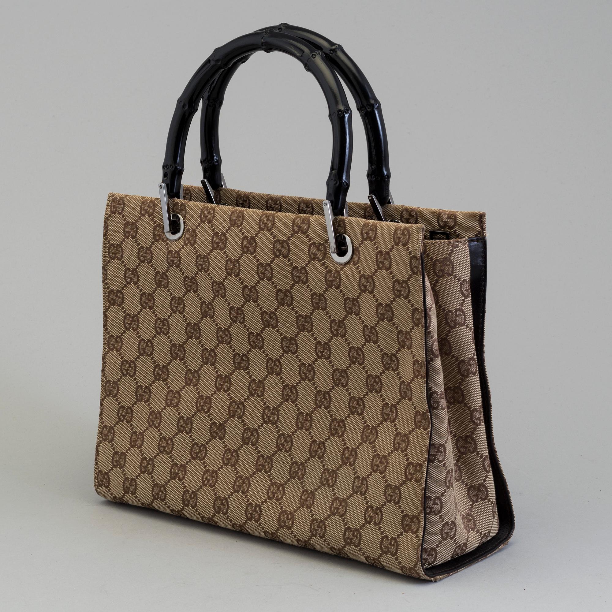 GUCCI, a monogram fabric hand bag and beauty bag.