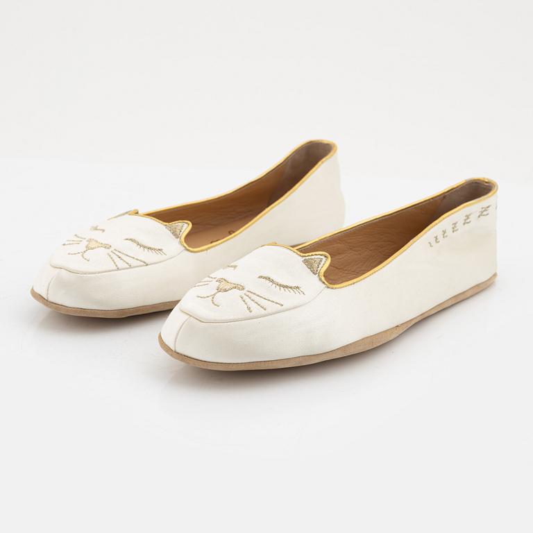 Charlotte Olympia, a pair of 'Cat nap' silk flats, a sleeping mask and a toilet bag, size S.