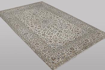 A carpet, Kashan, ca 328 x 205 cm.