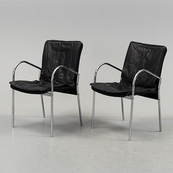 A pair of 1980s leather chairs.