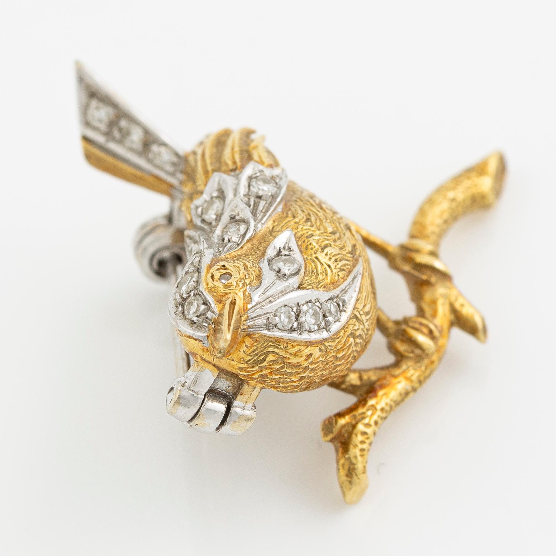 Brosch i form av en fågel 18K guld med åttkantslipade diamanter.