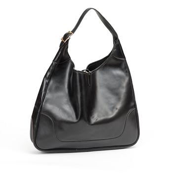 A 1970s black leather handbag "Trim Bag" by Hermès.