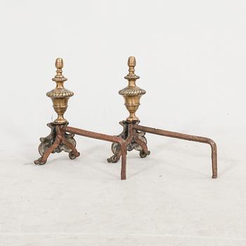 A pair of French metal chenets later part of the 19th century.