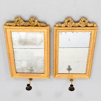 A pair of mirrored wall sconces from the latter half of the 20th century.