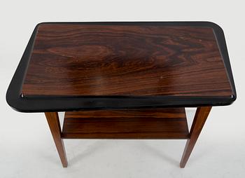 A second half of the 20th century rosewood mirror with table.