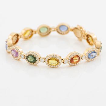 Bracelet 18K gold with oval multi-coloured sapphires and round brilliant-cut diamonds.