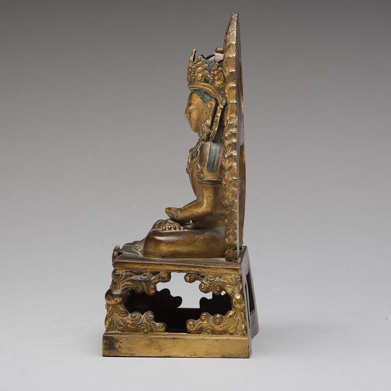 A gilt bronze seated figure of Amitayus, Qing dynasty, Qianlong period, dated by inscription.