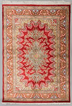 An old silk signed Ghom carpet ca 199 x 129 cm.