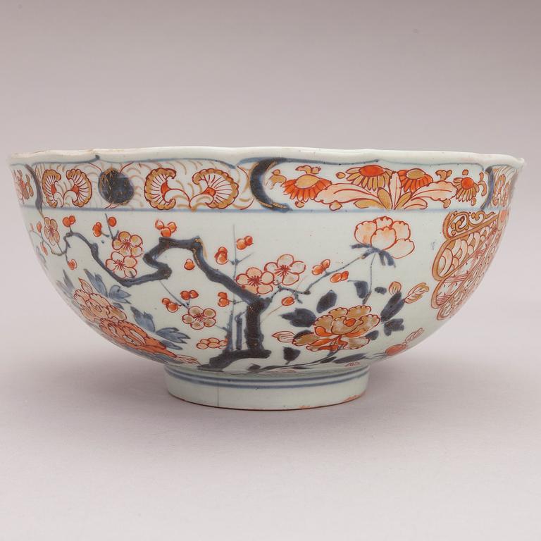 Four Chinese porcelain dishes and a Japanese porcelain bowl, 18th Century.