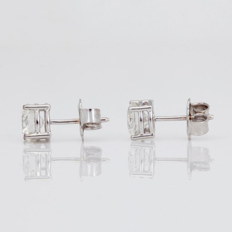 A pair of brilliant cut diamond earrings. The diamonds are 1.00ct and 1.00ct with quality G/VVS2.