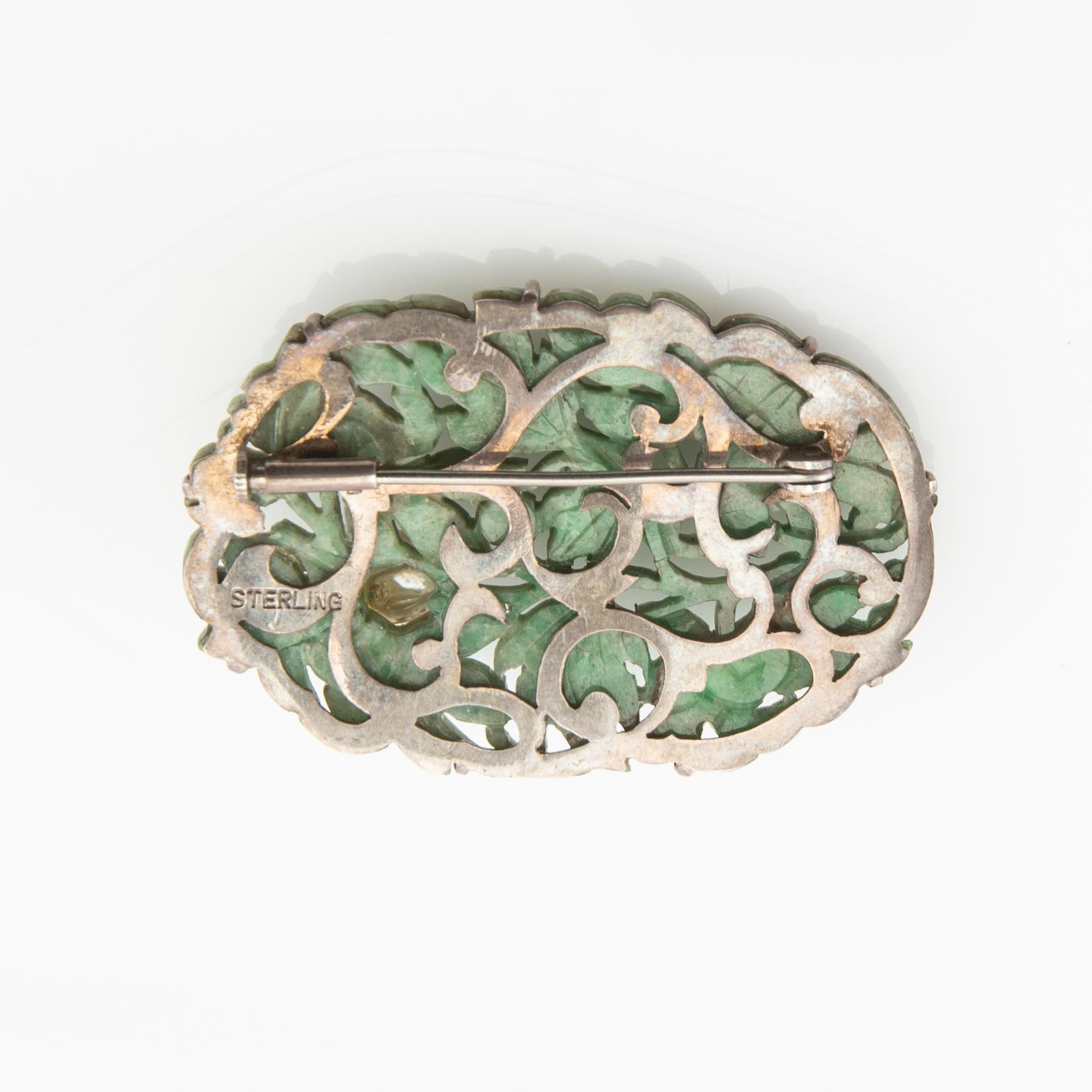 Brooch carved green stone with a cultured pearl set in silver, Japan.