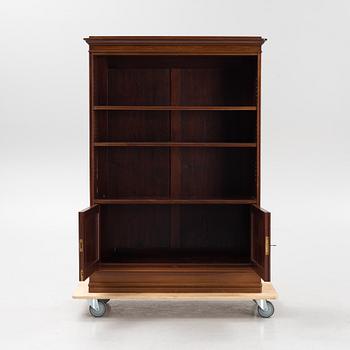 A mahogany bookcase with cabinet, 20th Century.