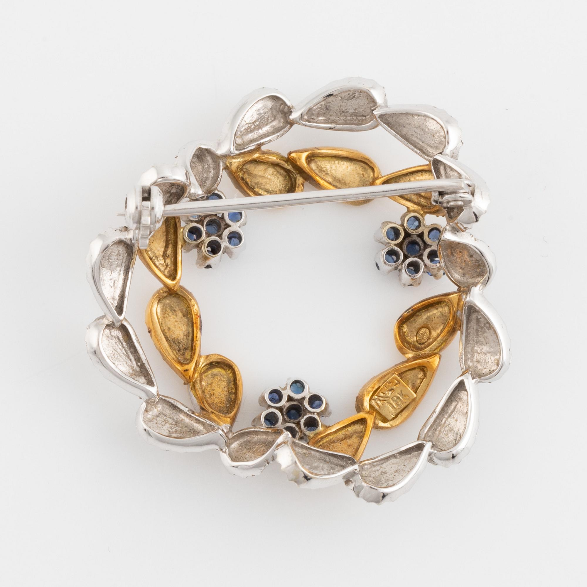 Brosch, krans 18K tvåfärgat guld och safirer.