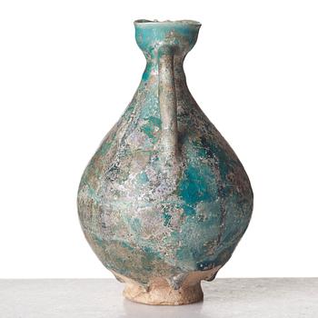 A EWER, pottery, Persia 13th century, probably 
Kashan, height ca 17,5 cm.