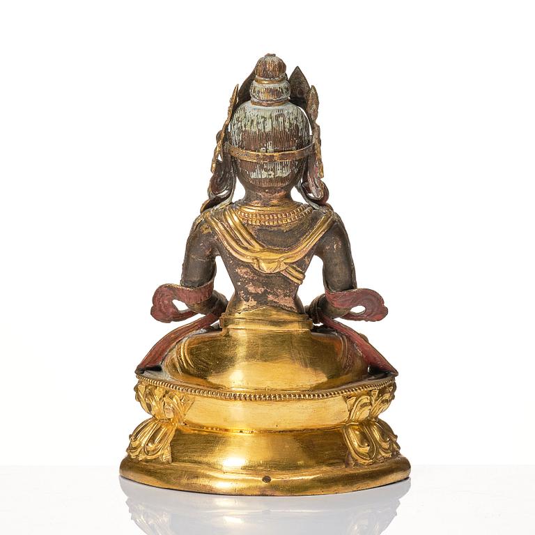 A Mongolian, partly gilt reoussé sculpture of Amitayus, 19th Century.