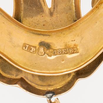 An 18C gold brosch J Pettersson Stockholm 1919 weight 6,2 grams, height 5 cm.