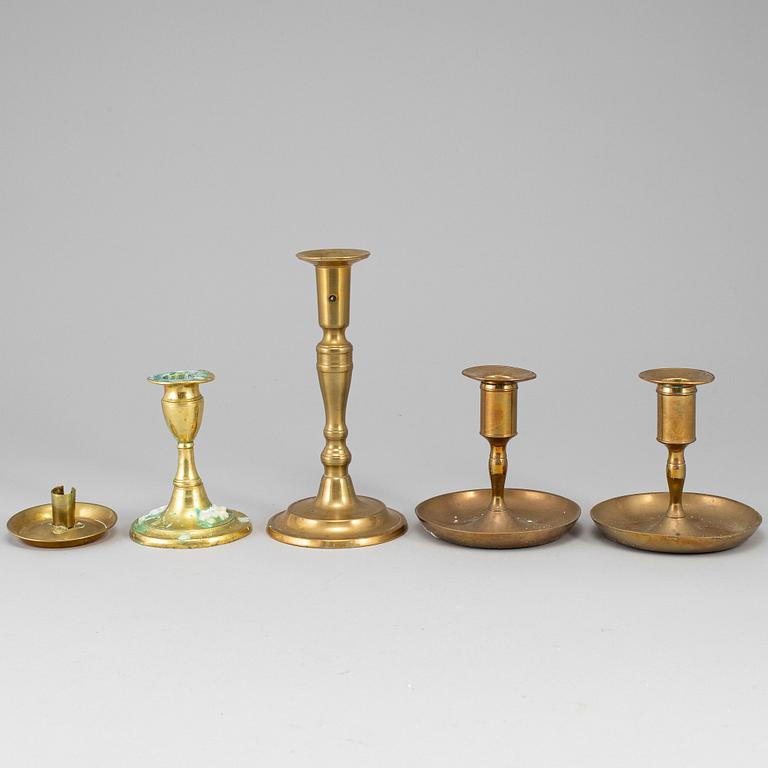 Five brass candlesticks, 18th/19th century.