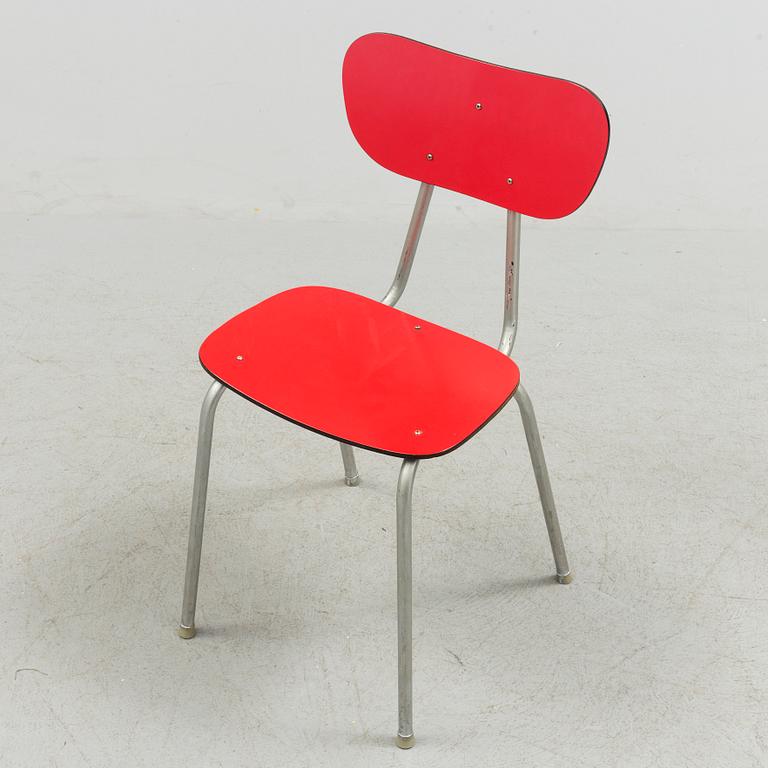 A mid 20th century table and chair.