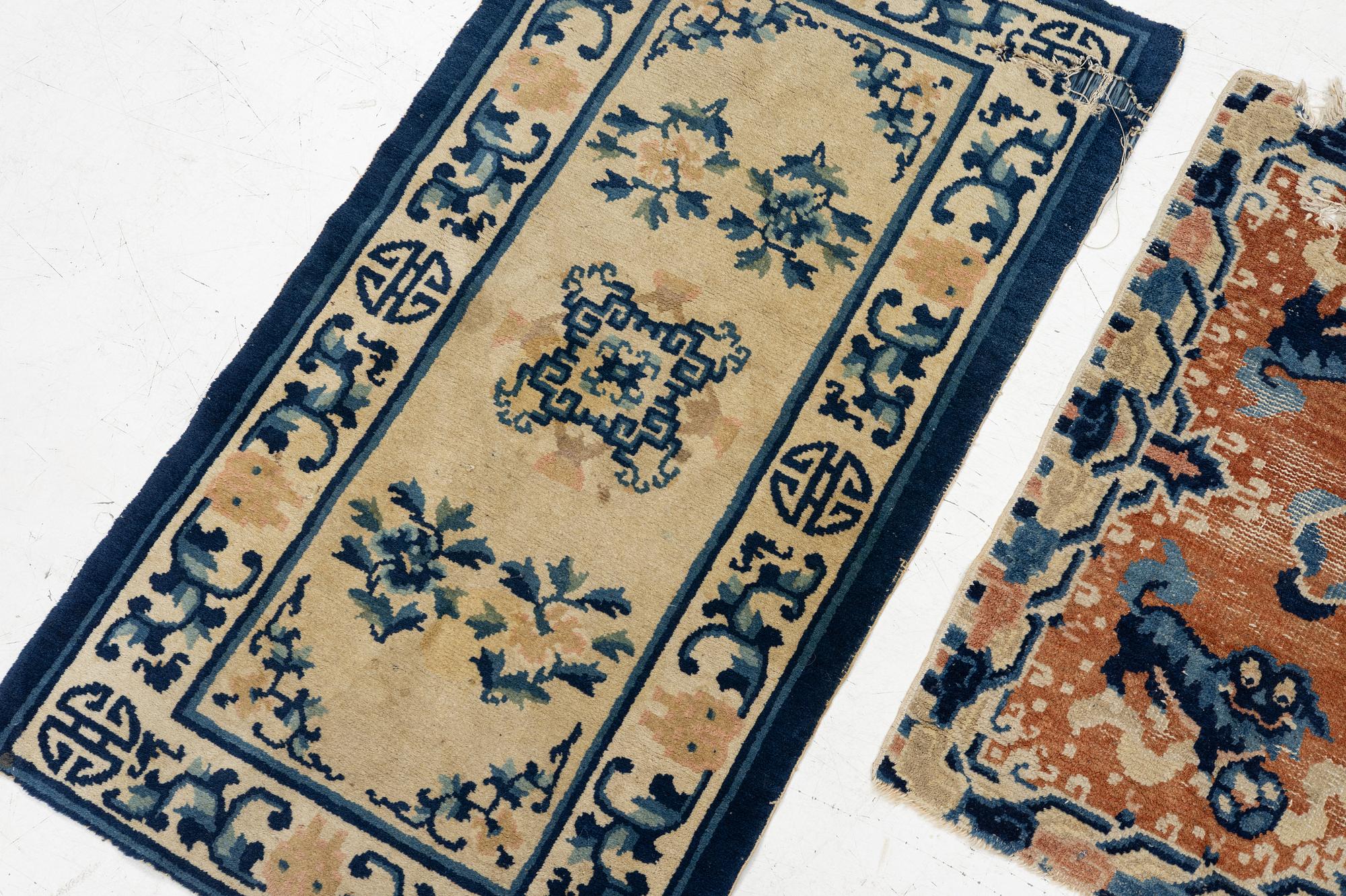 Two Chinese carpet fragments, late Qing dynasty.