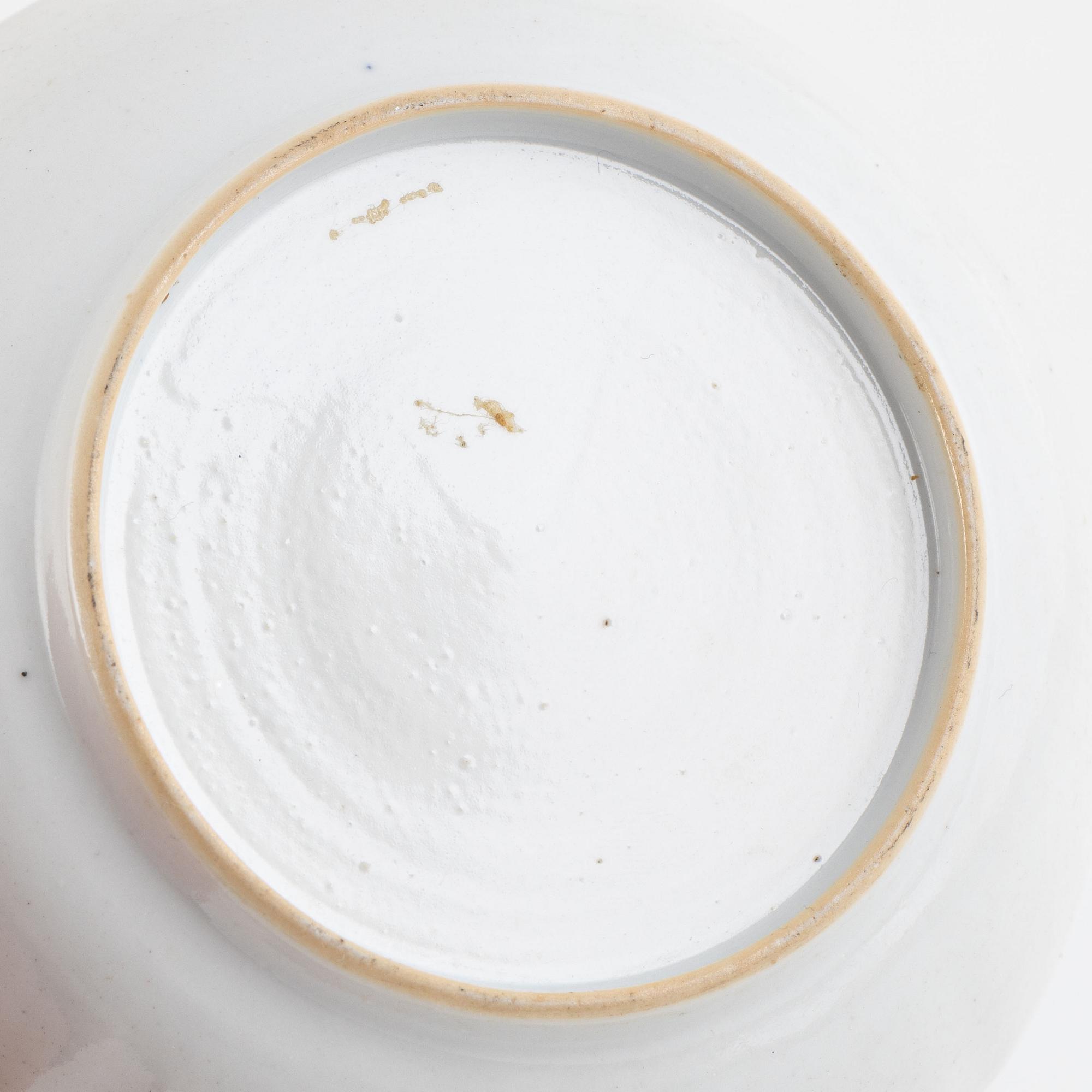 A small Chinese export tureen with cover, two cups, a saucer and a jug with cover, Qing dynasty, 18th century.