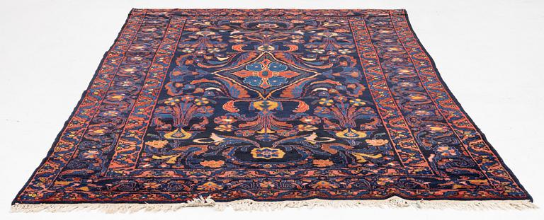 A semi-antique Khoigân village carpet, Feridan area, ca 314 x 209 cm.