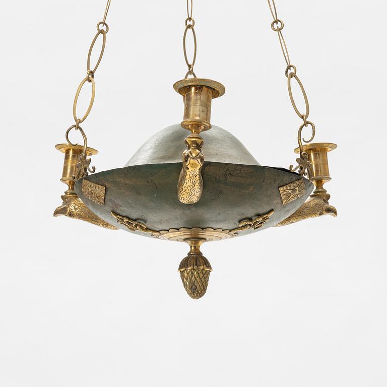 A Swedish Empire three-light gilt brass and tole hanging-light, early 19th century.