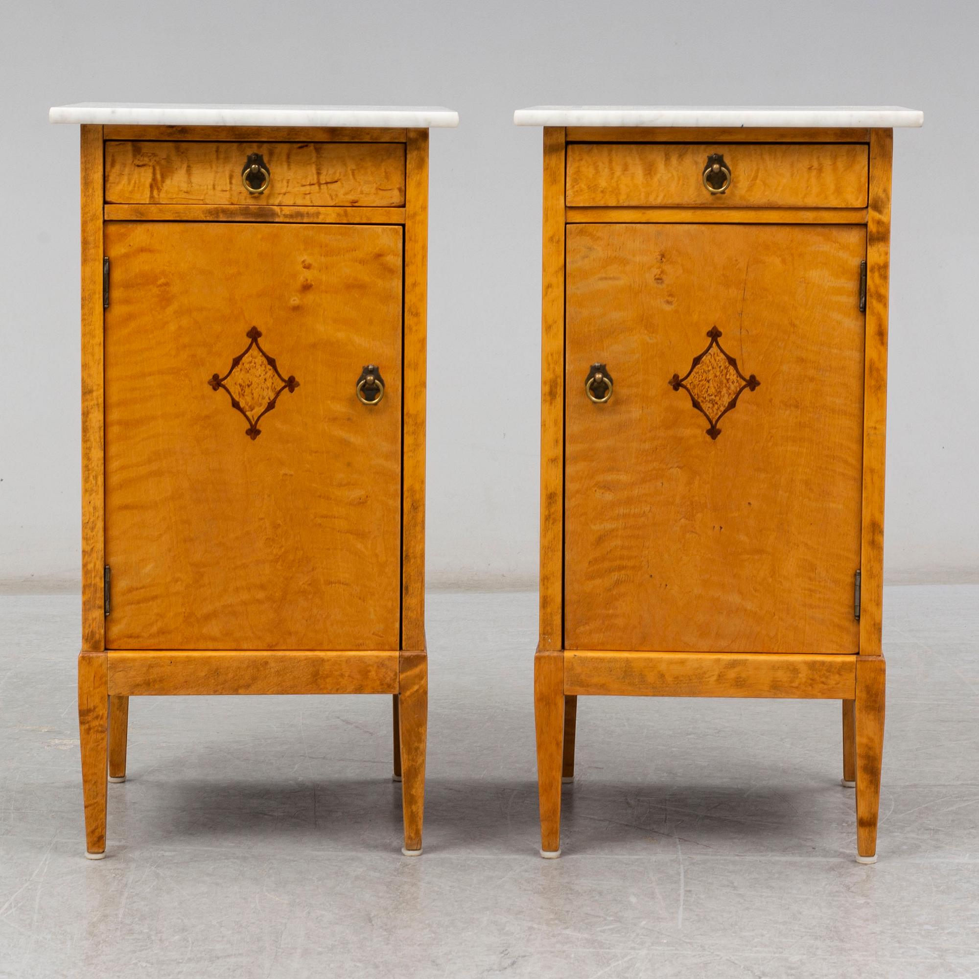 A pair of bedside tables from the first half of the 20th century.