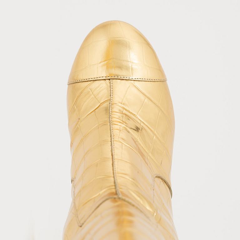 Chanel, a pair of Crocodile Embossed Metallic Calfskin Gold High Boots, size 37C.