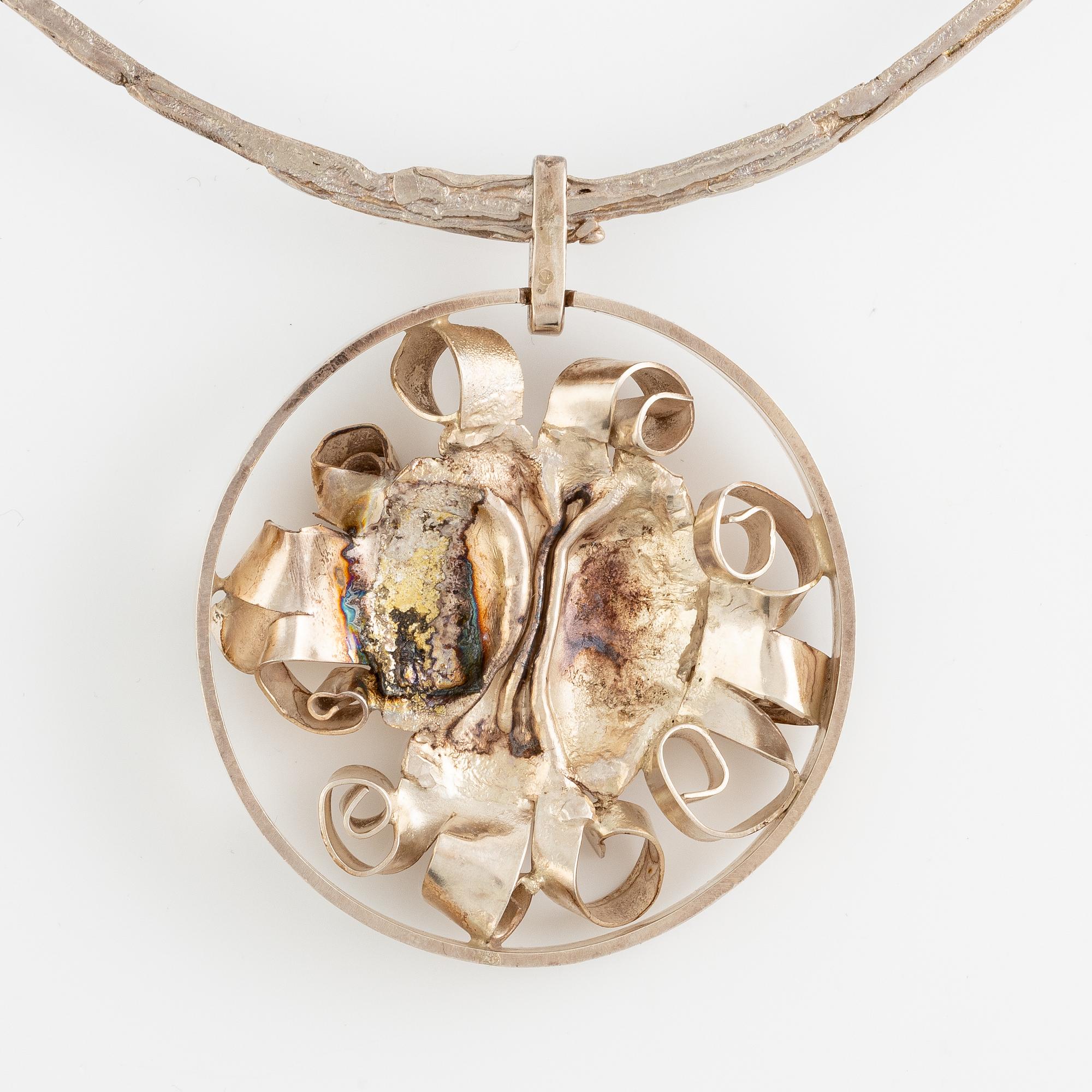 Lars Arby, three neck rings with pendants, silver, Gothenburg including 1977, 1978, and 1982.