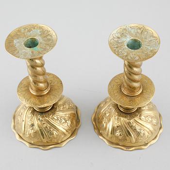 A pair of brass candlesticks, 18th century.